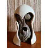 A Studio pottery sculpture, unsigned, in contrasting grey glazed interior and white exterior.