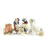 A group of Victorian Staffordshire flatbacks and figurines to include a fairing figurine titled "The