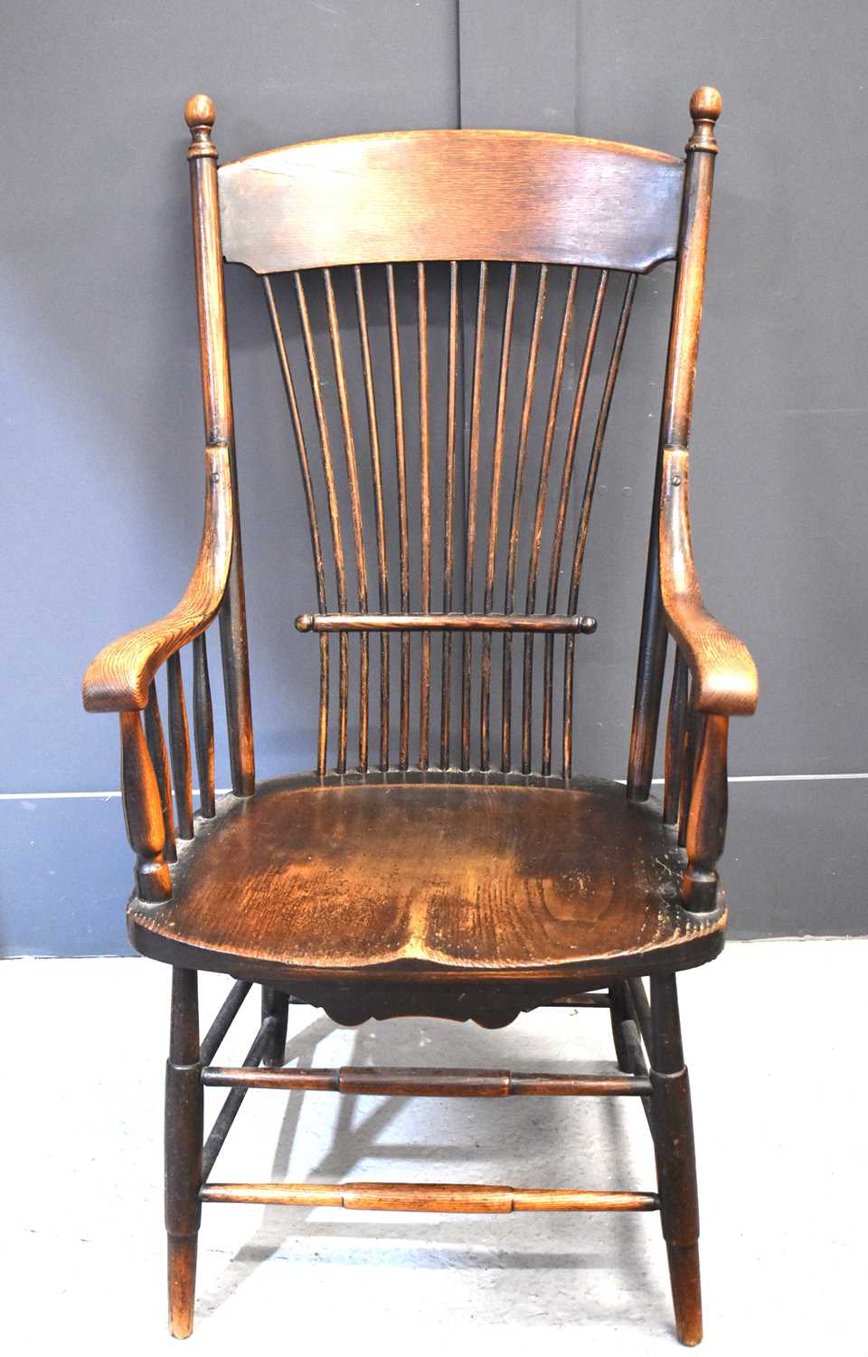 An American late 19th century yew and elm comb back spindle armchair, with turned legs and supports,