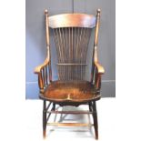 An American late 19th century yew and elm comb back spindle armchair, with turned legs and supports,