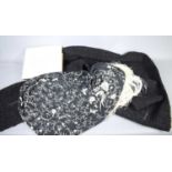 A vintage black astrakhan shawl together with a vintage Spanish shawl decorated with flowers and