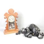 An Ansonia Company bracket clock, the etched glass decorated with a bird and a spider's web,