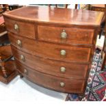 A 19th century mahogany bow fronted chest of drawers, with brass lion head ring handles, 60cms