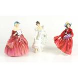 Three Royal Doulton porcelain figurines, "Minuet", "Lilac Time" and "Genevieve".