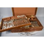 An early 20th century oak cased silver plated part canteen of cutlery, Sheffield, with inner tray,