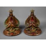 A pair of painted plasterwork corbels, in the form of grotesque masks, 22cm high, 18cm wide.