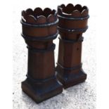 A pair of Victorian crown top salt glazed chimney pots, 92cm high.