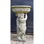 A reconstituted stone bird bath,with cherub support, 89cm high.