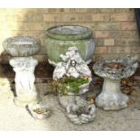 A reconstituted stone urn shaped planter, a cherub form bird bath and other ornaments.