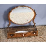 A 19th century mahogany toilet mirror with oval mirror and three drawers to the base, 58cm high by