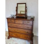 A George III mahogany chest of drawers, the rectangular top above three short and three long