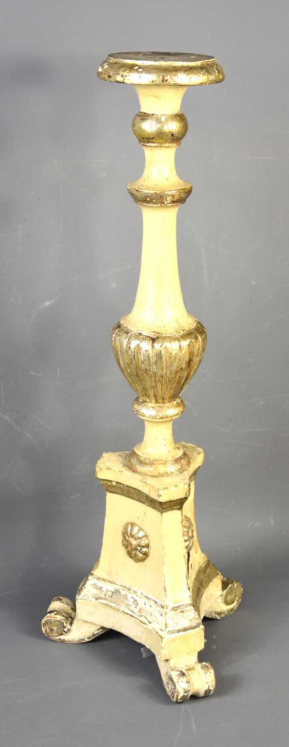 An Italian painted wood pricket stick with reeded column and triangular base, 63.5cm high.