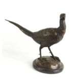A 20th century small bronze pheasant, raised on a marble plinth, 31cm high.