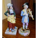 A pair of German porcelain figurines, one of a gentleman playing the violin.