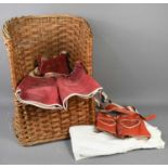 Two red leather German children's lederhosen and an Edwardian christening gown, together with a