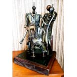 A 20th century bronze sculpture, composed of mechanical parts to form three figures, unsigned,