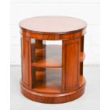 A 20th century mahogany cylinder form bookcase, 64cm high by 58cm diameter.