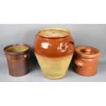 A group of glazed and unglazed jars of various sizes, the largest measuring 40cm high.