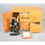 A vintage SPI microscope with oak cased cabinet with various drawers containing slides, tweezers,