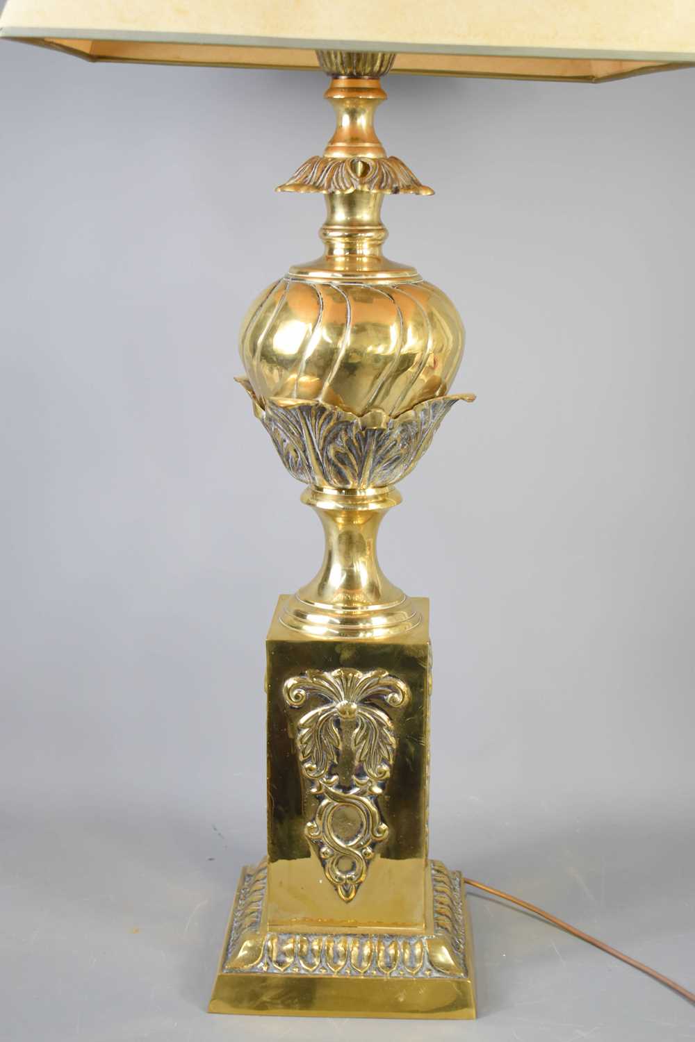 An antique brass lamp base, embossed with decoration, with cream shade, 95cm to the top of shade. - Bild 2 aus 2