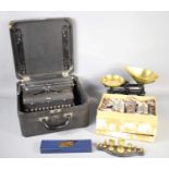 A vintage Royal typewriter together with a set of scales and weights and a presentation box