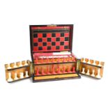 A Victorian coromandel games compendium box, having folded draughts and chess board, with red