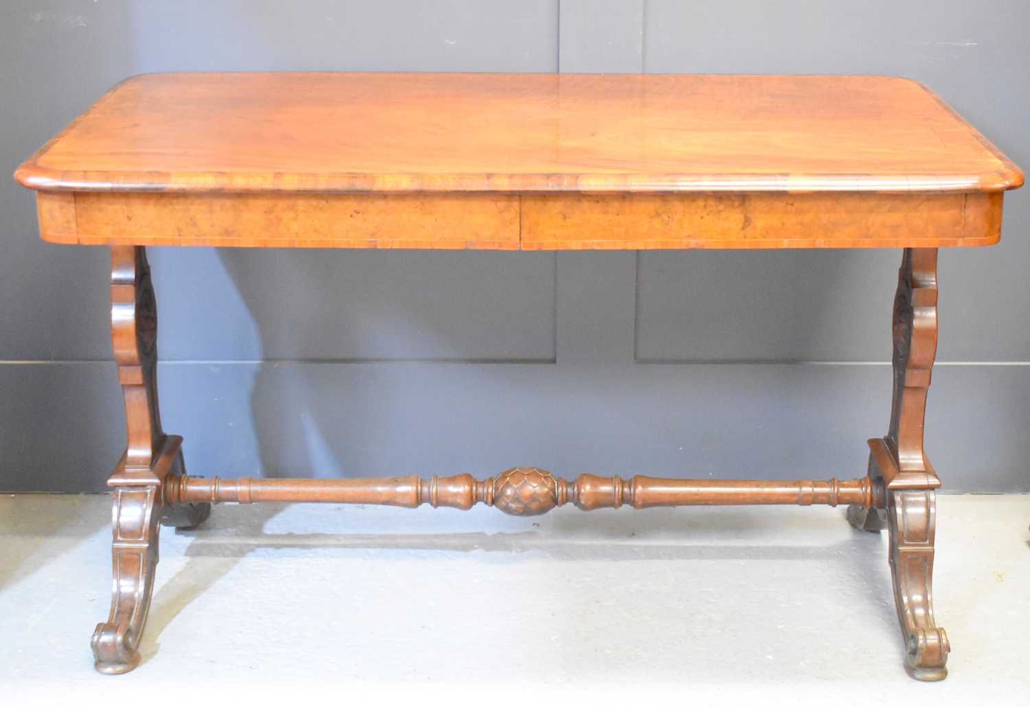 A 19th century Gillows mahogany and crossbanded burr walnut library writing table with drawer below,