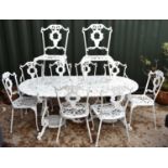 A Regency-style painted aluminium garden table and set of ten chairs with grape motif.
