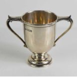 A silver twin handled trophy by the Goldsmiths & Silversmiths Co Ltd, London, 1913, 5.4toz.