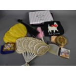 A group of ladies accessories, comprising a Lulu Guinness purse, vintage paper fan, feather fan in