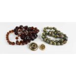 A group of vintage jewellery comprising a string of cloisonne beads, a pique brooch, an oval locket,