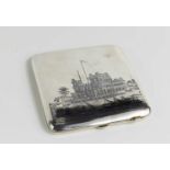 A niello and white metal cigarette case, possibly Egyptian silver, decorated with river scenes, with
