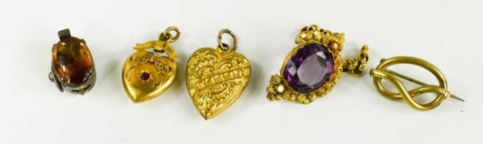 Two gilt metal 19th century heart form pendants, a small brooch, a Georgian gold and silver clasp