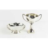 A silver twin handled trophy, and a silver pedestal dish with pierced decoration to the edge, 6.