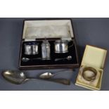A silver cruet set comprising salt and mustard pots, with blue glass liners and spoons, by William