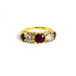 An 18ct gold, ruby and diamond ring, the two diamonds approximately ½ct each, interspersed with