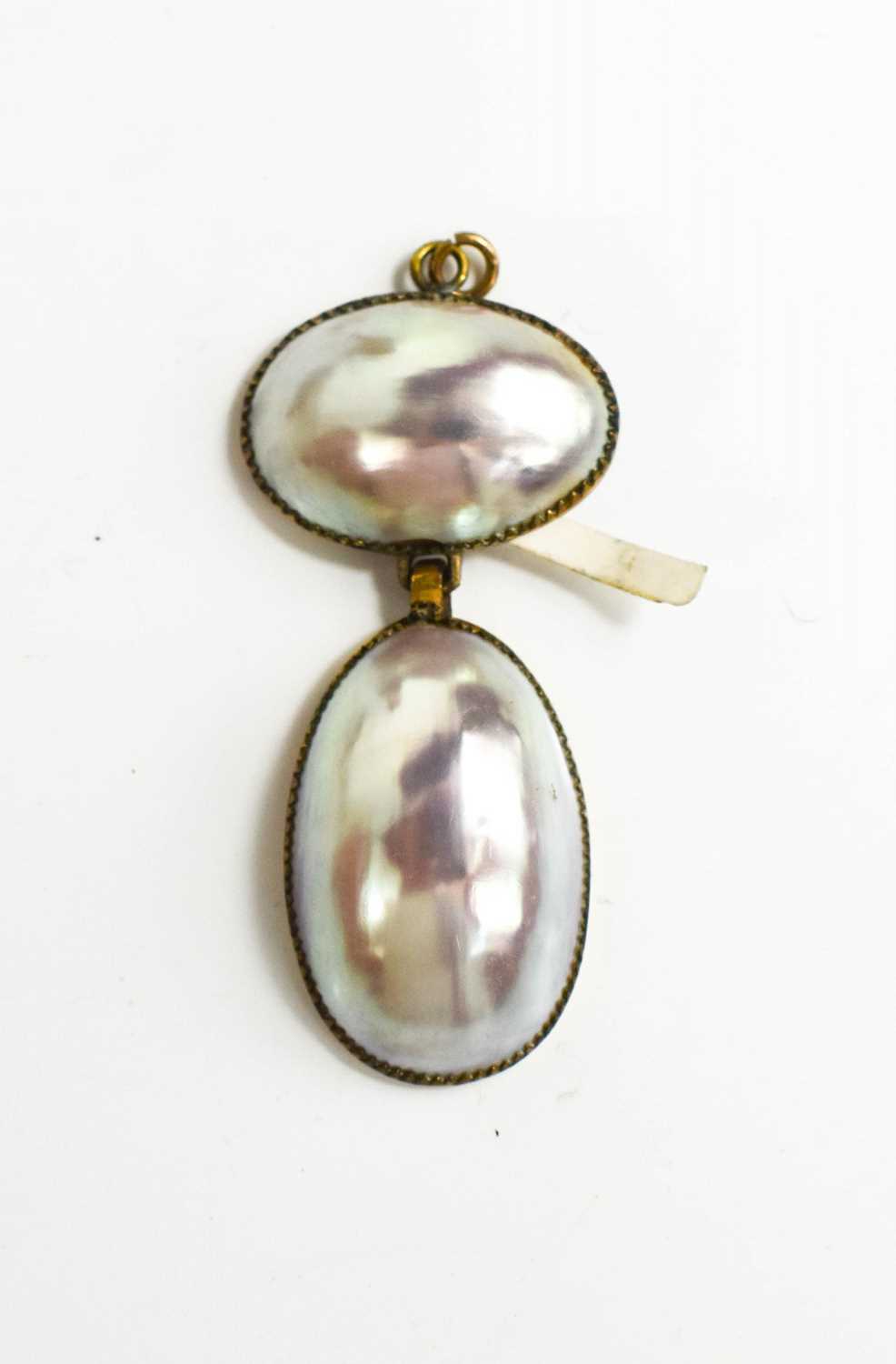A Georgian gilt metal and pearl pendant, 4½cm high.