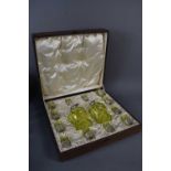 A fine Edwardian cased cut glass liquor set, by Army & Navy Ltd, London 1908, comprising of two lime