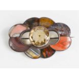 A Scottish silver, agate and pale quartz brooch, the circular cut quartz bordered by various