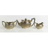 A silver plated tea set with emblems of Scotland, Ireland, Southern Ireland, and a Kangaroo, with