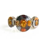 A Scottish silver, agate and yellow topaz set bracelet, composed of seven oval links, each set