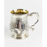 A Georgian silver tankard, with chased and repousse decoration, and gilded interior, 6.85toz,