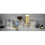 A collection of vintage scent and perfume bottles including a circular cut glass bottle, the