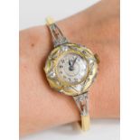 An 18ct gold and diamond ladies cocktail watch, with Arabic dial,the circular dial inset with