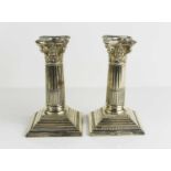 A pair of silver candlesticks, in the form of Corinthian columns, by Walker & Hall, Sheffield 1923,