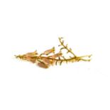 A gold and rock crystal brooch in the form of a spray of lily of the valley, (indistinct