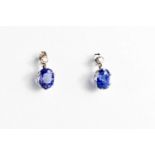 A pair of white gold, blue sapphire and diamond stud earrings, 2.69g.