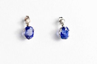 A pair of white gold, blue sapphire and diamond stud earrings, 2.69g.
