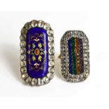 Two Victorian white metal and paste set rings, one with blue enamel elongated oval centre