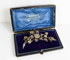 A 19th century silver and white & yellow paste brooch in the form of a floral spray, with